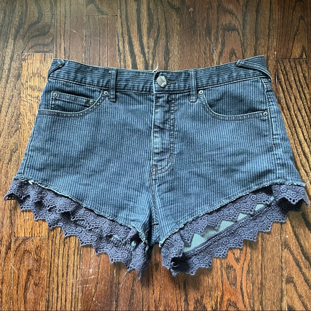 Free people denim shorts with lace trim